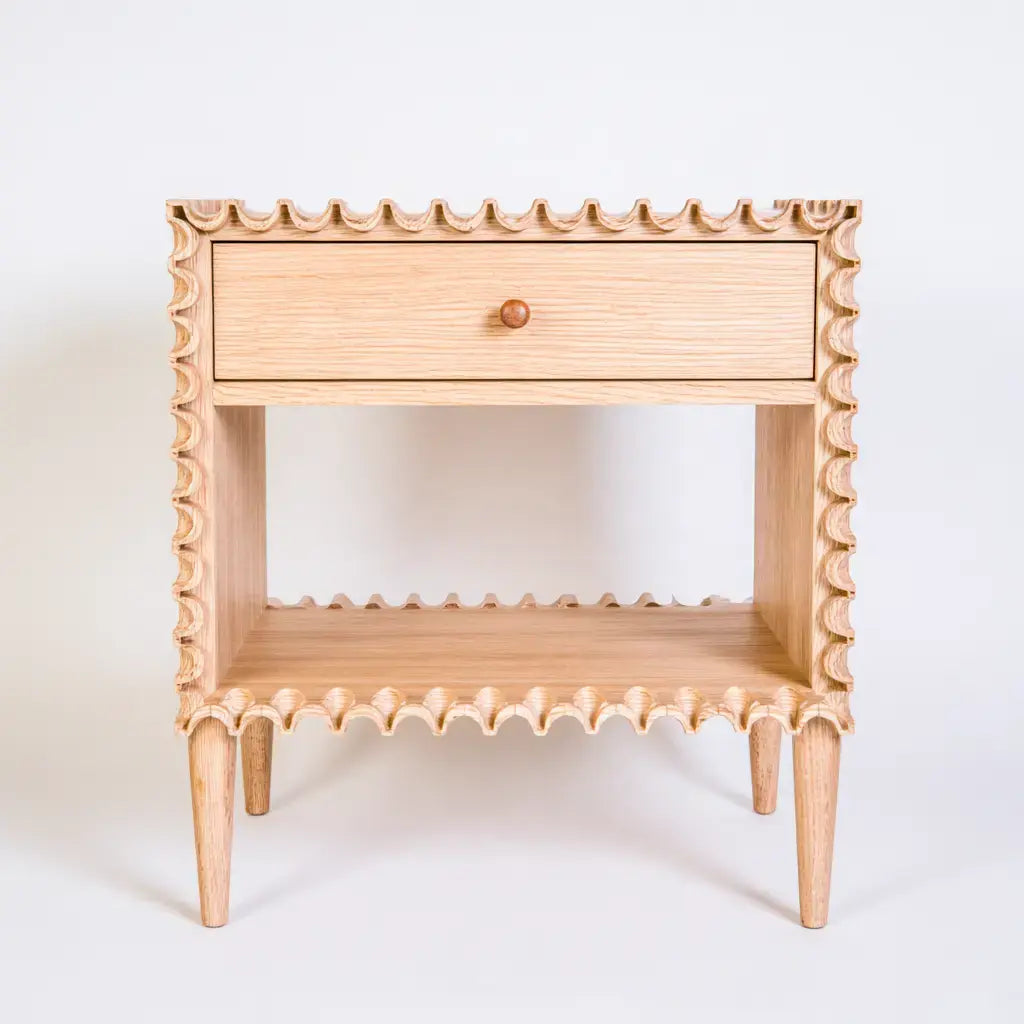 Pierandpoise beige nightstand with drawer and turned side panels, featuring a classic and elegant design.